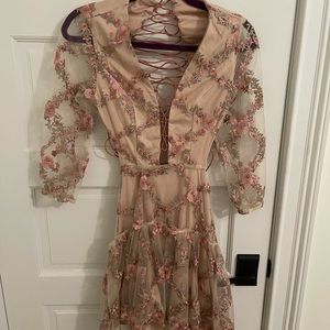 Beautiful dress with amazing detail. Both dresses never worn. Two dresses.